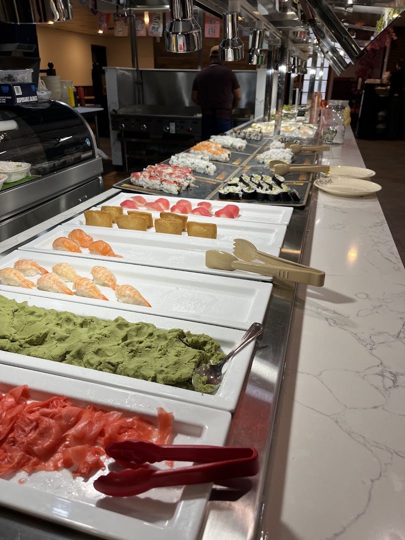 Assorted sushi rolls on a buffet counter