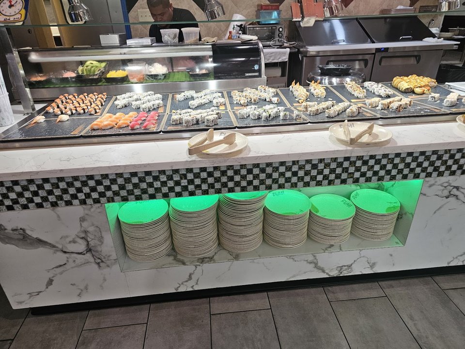 Buffet trays with sushi and grilled dishes
