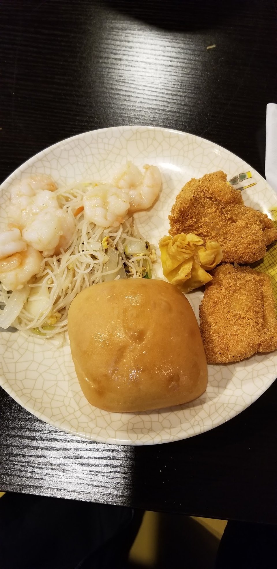 Grilled items beside sushi on a buffet line